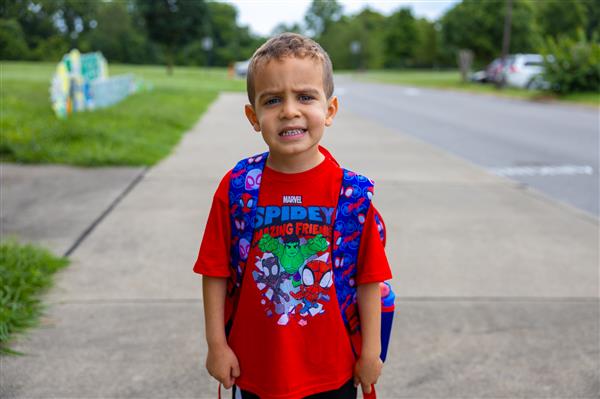 boy student walking to school